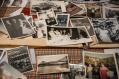 A scattering of old black and white photographs in The Last Princess of Lebanon.