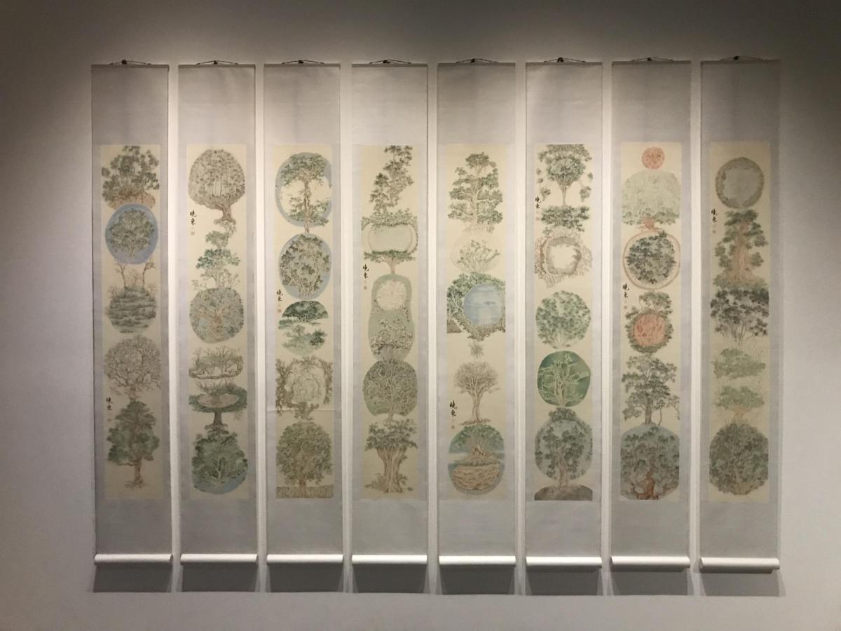 A piece of artwork that shows rows of trees on a screen at Ritual Eternal.
