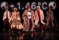 Five people dancing in further coats in The Orchard.