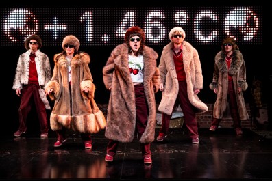 Five people dancing in further coats in The Orchard.