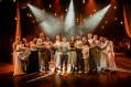 Fifteen performers on stage for the production of Songs for a New World.