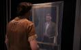A woman is looking at a man through a veiled frame in Three Plays.