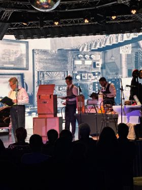 Four men in front of various contraptions in production of The War of The Worlds.