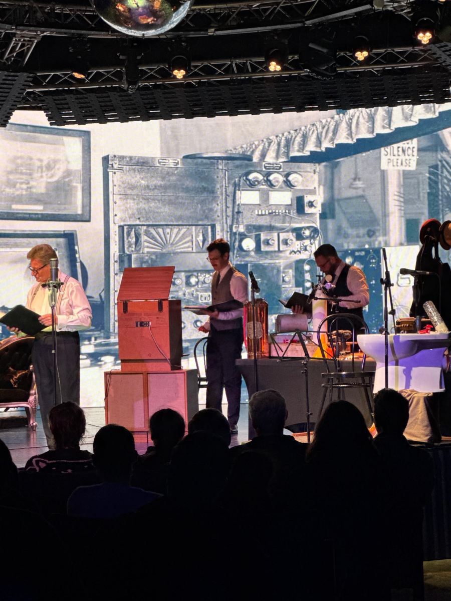 Four men in front of various contraptions in production of The War of The Worlds.