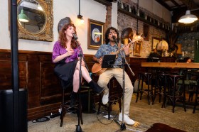 A man and a woman performing in a venue. NSW Arts Minister John Graham has announced red-tape changes to free up the night-time economy.