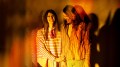 Publicity image for Griffin's 2026 production 'Afterglow', to be staged at Belvoir's downstairs theatre. Two fair-skinned young women with long hair, one wearing vertical striped clothes and the other wearing horizontal stripes, hold each other and laugh. The image is slightly fractured as if double-exposed, and shot in tones of yellow and orange.
