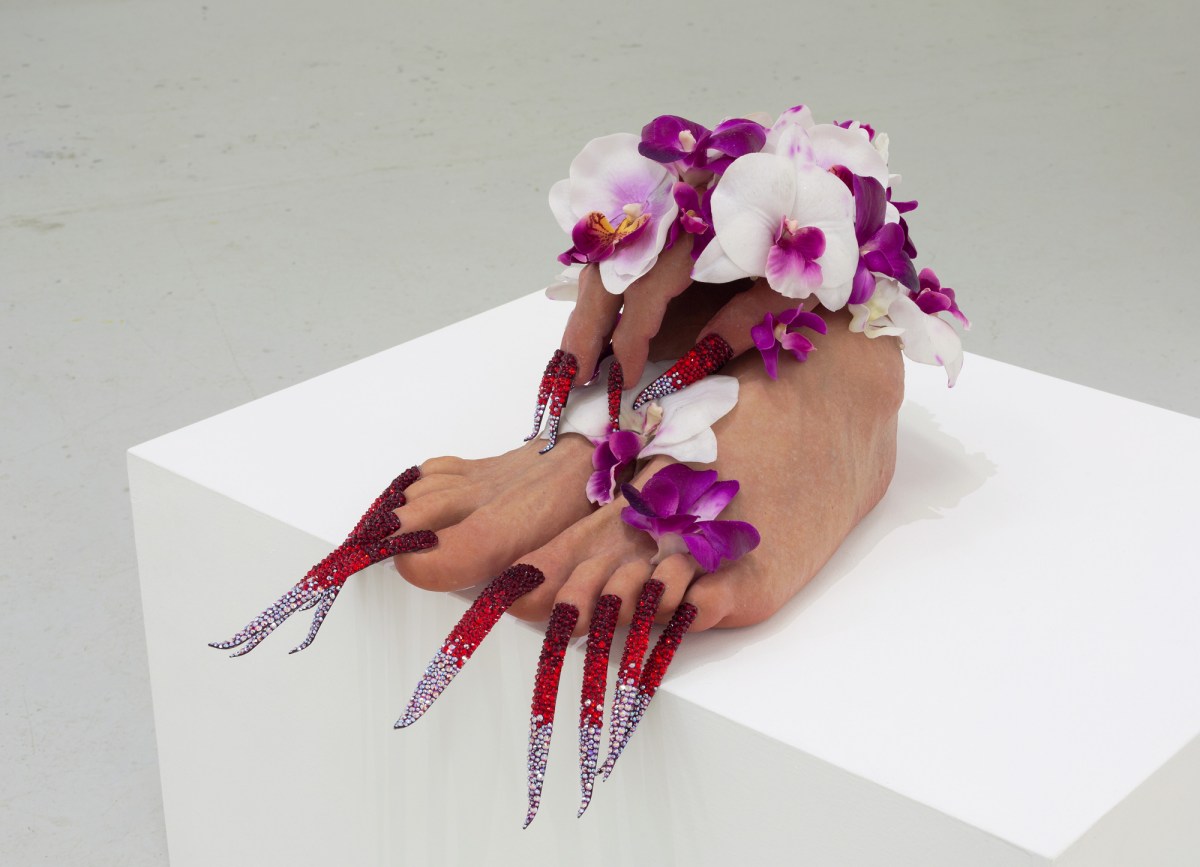 artwork on a pedestal of a food with long toenails of sparkles and orchids. 2026 Adelaide Biennial