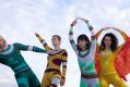 Dancenorth archival costumes from the 1990 production 'Desert Magic'. L-R: Michael Smith, Sabine Crompton-Ward, Tiana Lung and Marlo Benjamin. Four dancers pose playfully in brightly coloured, abstract, skin-tight costumes from four decades ago.