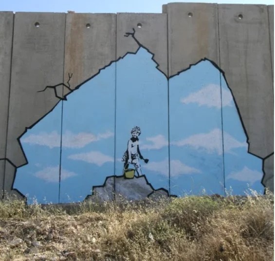 Banksy's 2005 piece on the walls of the West Bank.