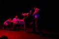 A sequence from Tegan Jeffrey-Rushton's 'Overture', Adelaide Fringe 2025 season. The prduction is being remounted for IDEA'25. Four dancers perform a contemporary dance production on a red-lit stage.