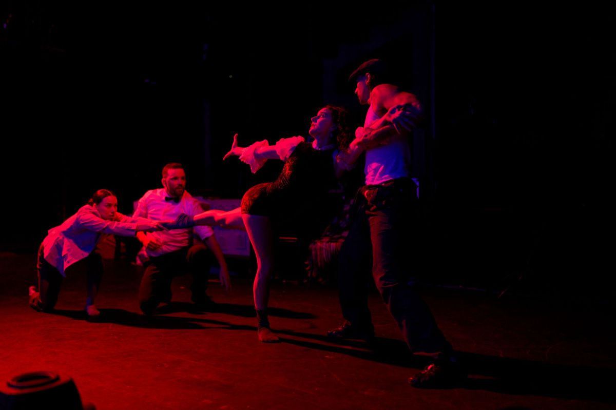 A sequence from Tegan Jeffrey-Rushton's 'Overture', Adelaide Fringe 2025 season. The prduction is being remounted for IDEA'25. Four dancers perform a contemporary dance production on a red-lit stage.