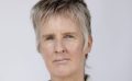 Head shot of Keri Glastonbury, who has short ashy hair.