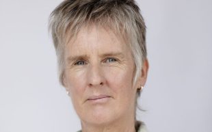 Head shot of Keri Glastonbury, who has short ashy hair.