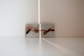 two paintings with fingers touching across them with a crack of light. Superannuation