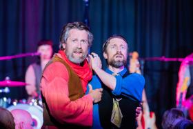 L-R: James Pender as Burke and Sammy J as Wills in a scene from 'Fiasco: A Burke & Wills Musical' at Melbourne Fringe. Two fair-skinned, bearded men wearing stylised 19th century costumes clutch each other in a comically exaggerated fashion.