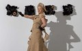 Melbourne fashion week. Photo of a model wearing a garment made out of ute bags posing.
