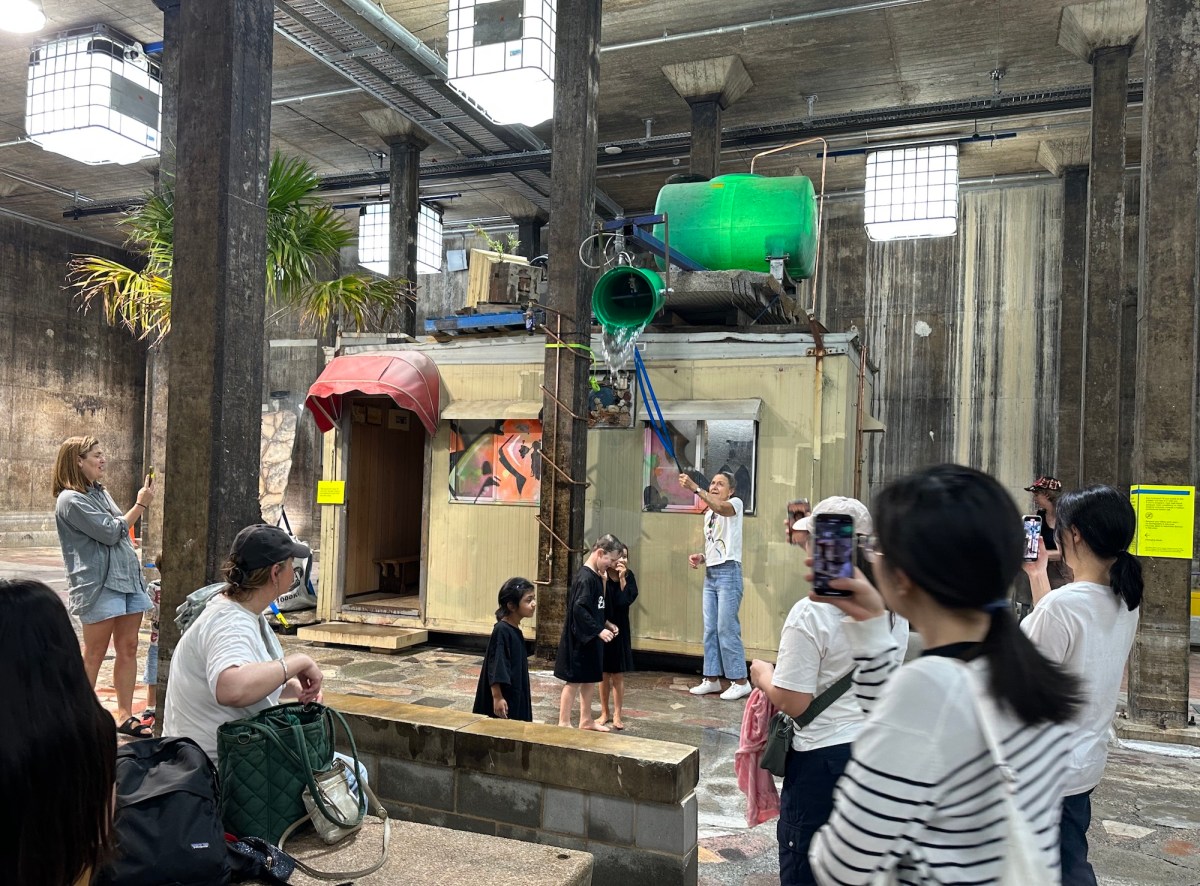 installation of a shed and water feature in a gallery space with people watching taking photos. Mike Hewson