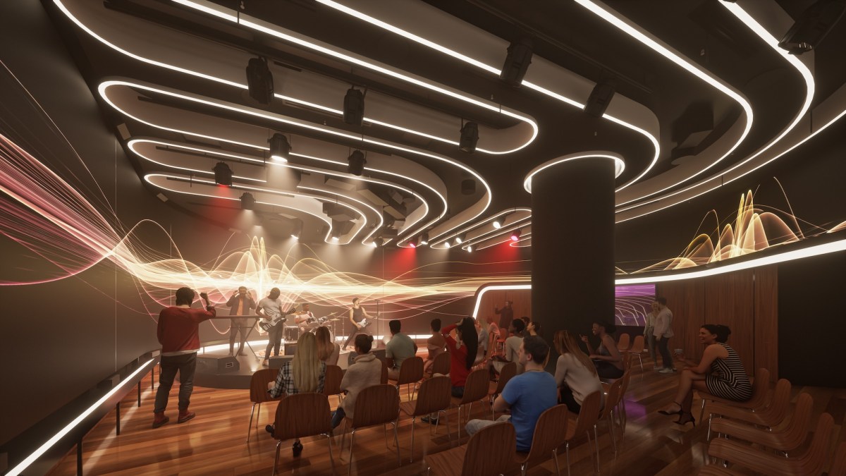 An immersive style theatre with screens and lights and lecture seating. Sydney Conservatorium Parramatta