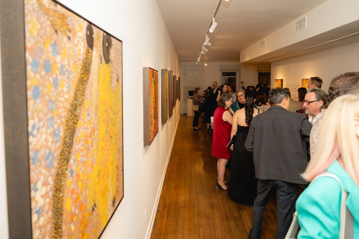 Visitors at gallery opening of exhibition of Aboriginal art.