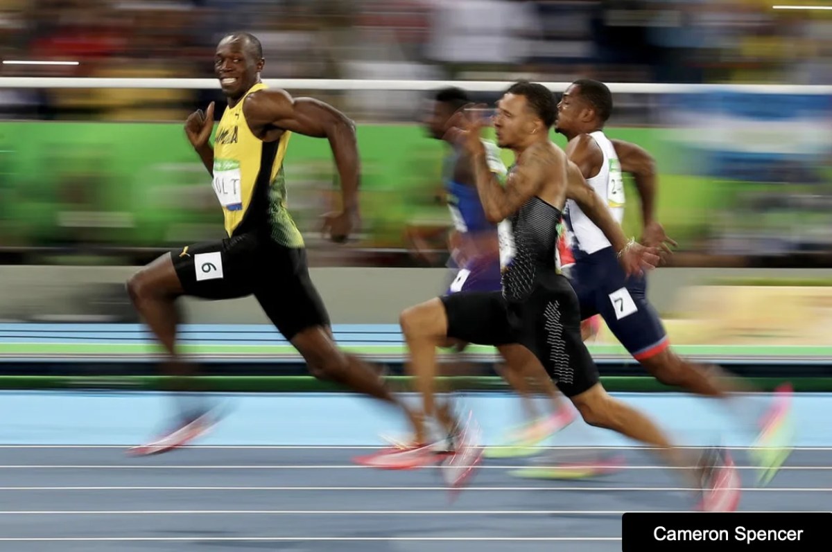 Group of men running a race, image taken by photojournalist. Head On Photo Festival.