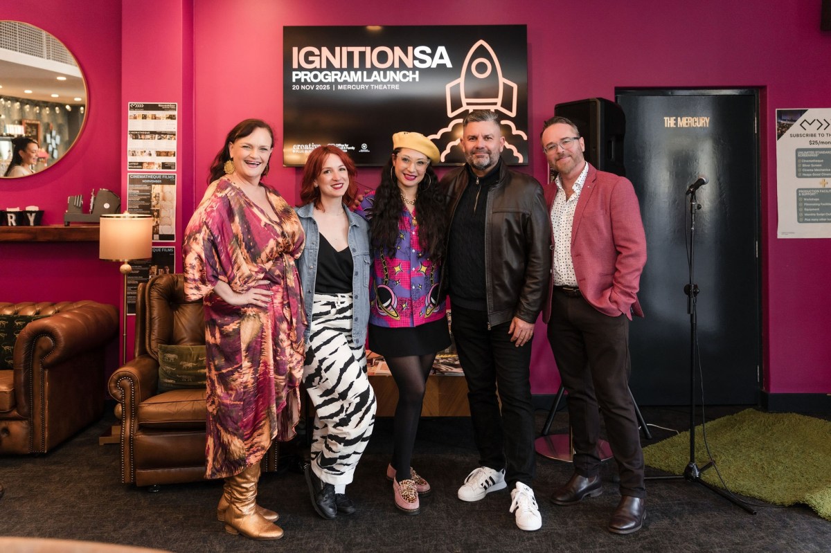 creative looking people having a group photo inside. IGNITION SA