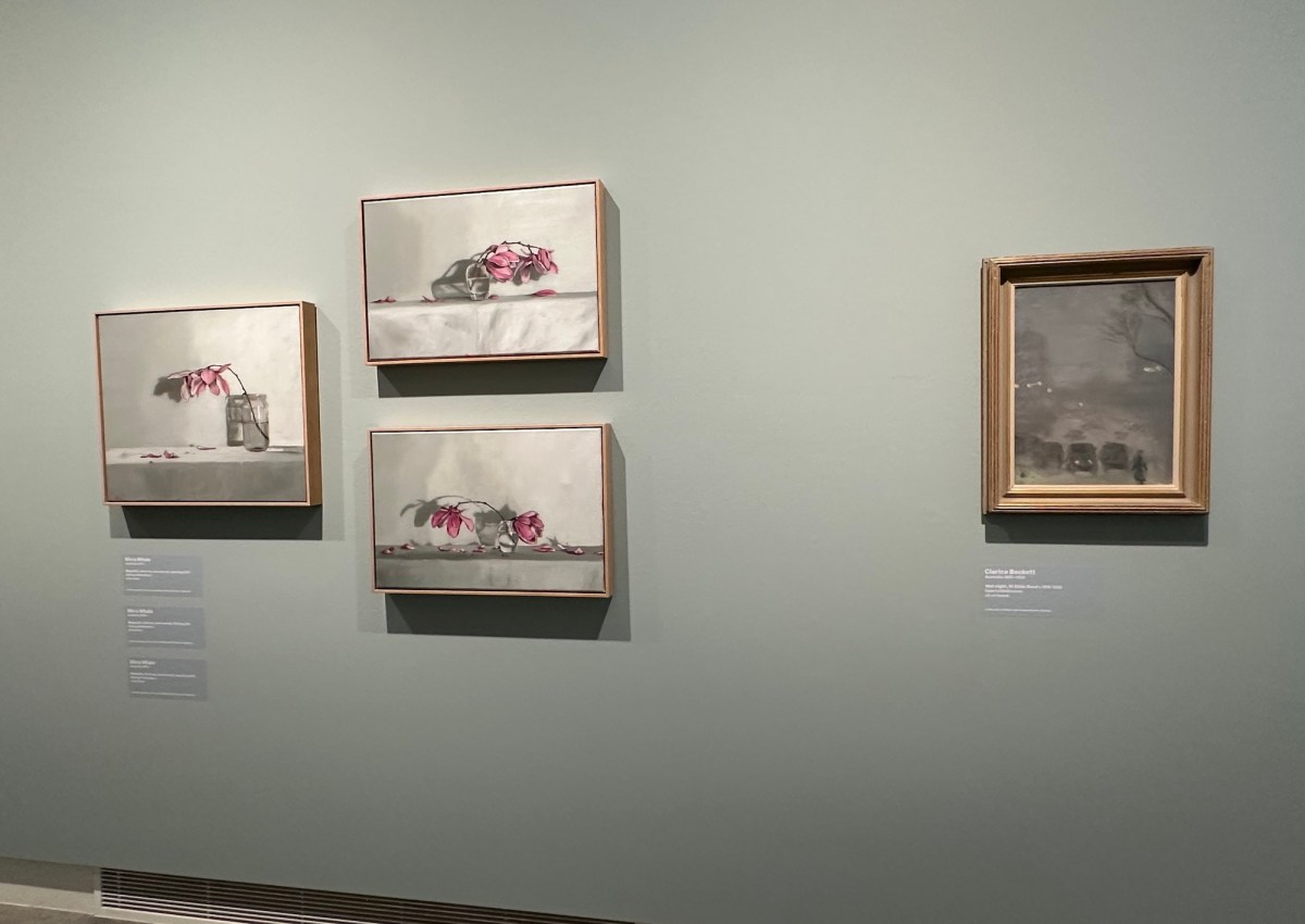 three paintings of a flower next to a misty landscape painting on a soft blue wall. Clarice Beckett