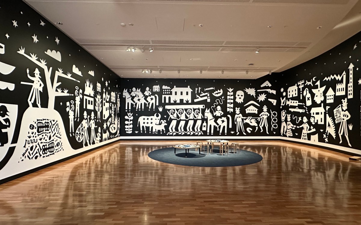 Walls with black and white graphic illustration in gallery setting. Tony Albert's Indigenous Triennial