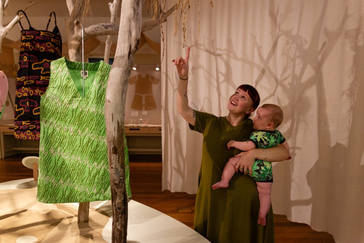 Museum visitor viewing Ungaire Reeds by Elisa Jane Carmichael and My IslandHome... by Dean Bingkin Tyson. Stories You Wear: Magpie Goose at Museum ofBrisbane 2025. Image: Red Handed Productions.