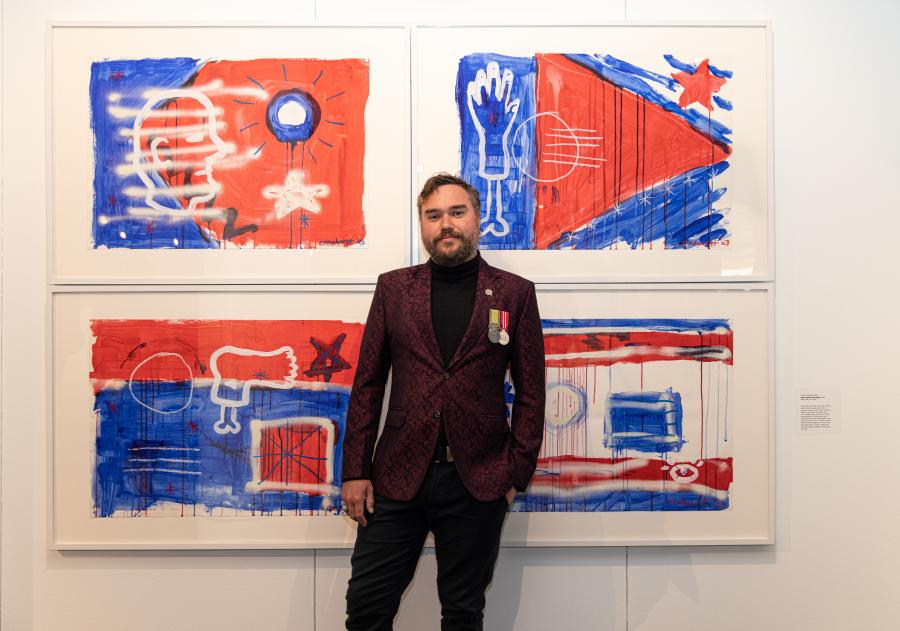 Napier Art Prize 2024 highly commended recipient artist Thom Crowhurst, pictured in front of his work Red White and Blue, 2023. Image supplied. Museum blockbusters 2026
