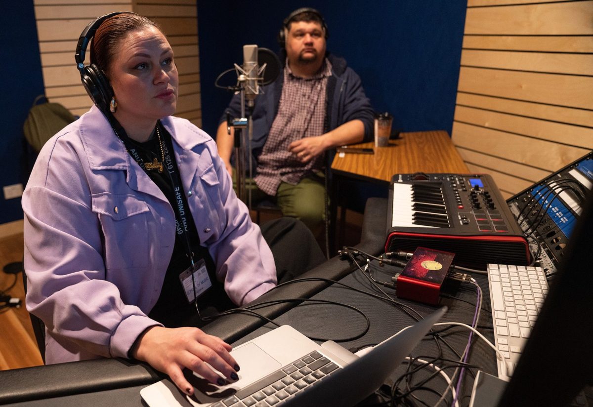 First Nations artist Jono (Eskatology) Stier works with mentor Candice Lorrae during the Space to Create event at the ANU School of Music in Canberrra.