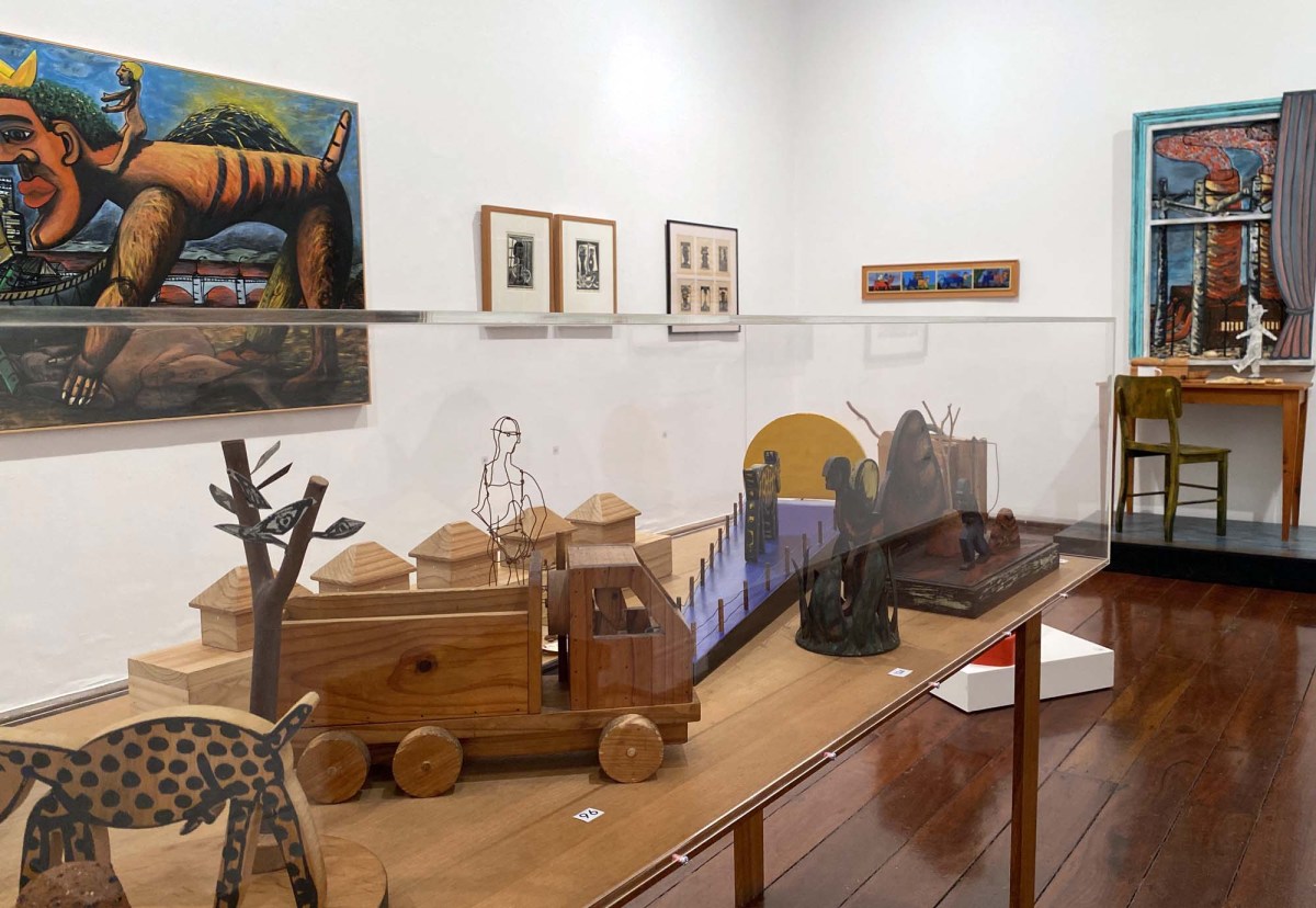Objet D'Art - Theo Koning and his Creative Self: a photo of a gallery space showing various colourful paintings, prints and small wooden assemblage and sculptural works by artist Theo Koning.