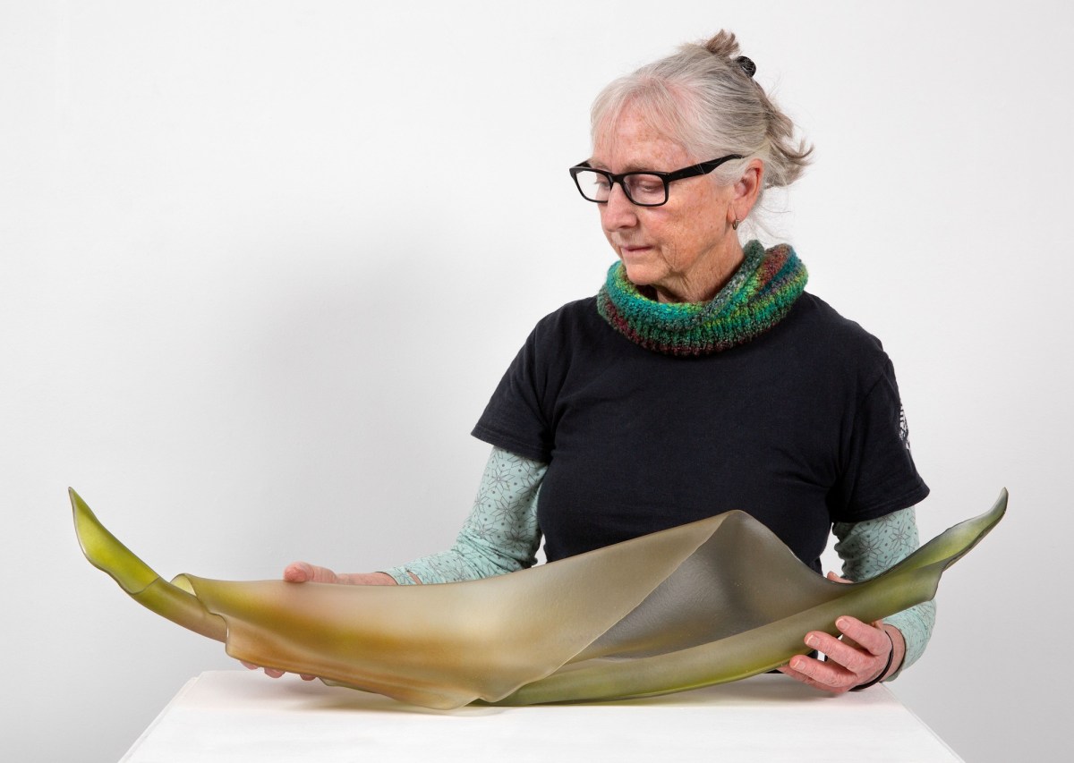 Kirstie Rea with her Loewe Craft Prize finalist work, ‘Repose 2’, 2024, kiln-worked glass. Image: Supplied.