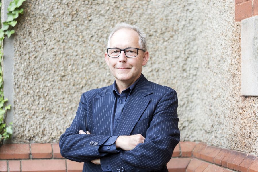ANAM's Nick Bailey. He wears a blue pinstripe suit and a blue business shirt with no tie. Nick has his arms folded and smiles at hte camera. He has a high forehead, short grey hair and wears glasses. arts sector appointments