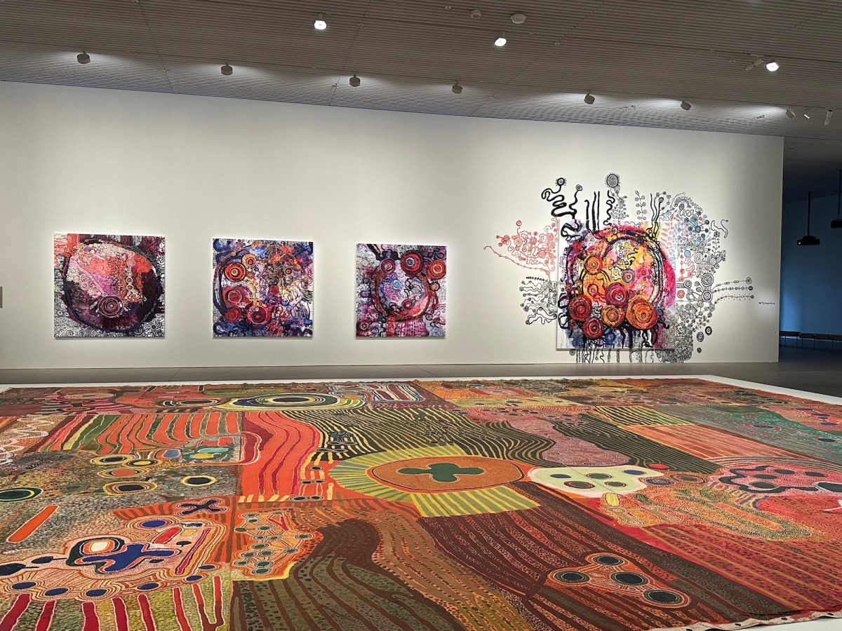 Installation view, 25th Biennale of Sydney: Rememory, Art Gallery of New South Wales, showing work by Ngurrara Artists at front and Yaritji Young at rear. Photo: ArtsHub.