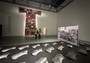 nstallation view, 25th Biennale of Sydney: Rememory, Chau Chak Wing Museum, showing Benjamin Work’s PÁPAAKI at front and Khalil Rabah’s Common Threads at rear.