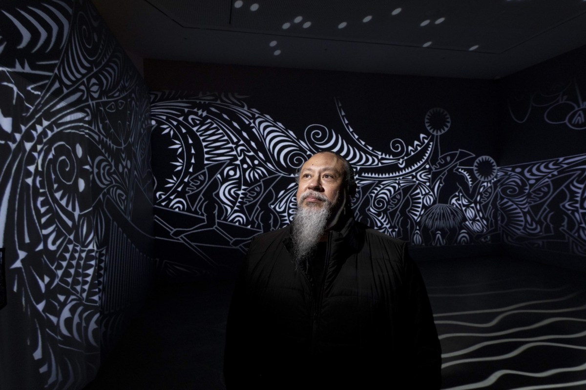 Brian Robinson with his work Zugubal at Newcastle Art Gallery, 2026. Photo: Peter Stoop.