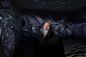 Brian Robinson with his work Zugubal at Newcastle Art Gallery, 2026. Photo: Peter Stoop.