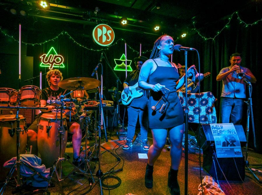 Melbourne-based band Owelu Dreamhouse play a live to air gig at 3PBS FM. The photo shows five musicians playing live, including front-woman Nkechi Anele.