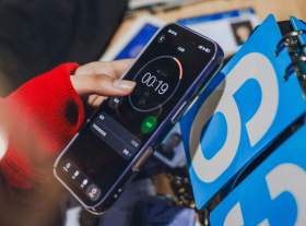 arts leaders: a photo of a woman's hand holding a smartphone that is showing the stopwatch app at 19 seconds to go.