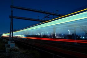 A train passes by at high speed, reduced to a blur of multicoloured lights in this long exposure image. arts sector appointments