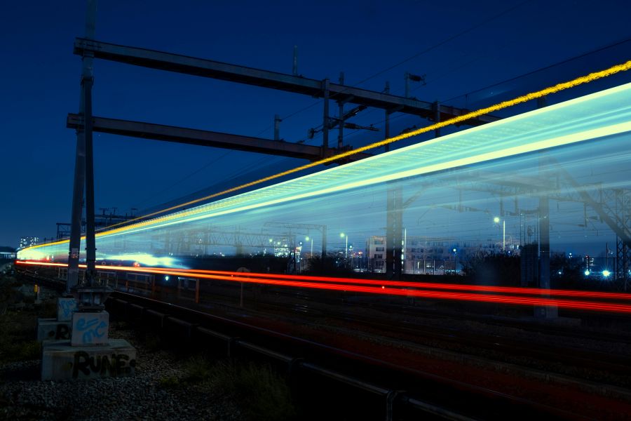 A train passes by at high speed, reduced to a blur of multicoloured lights in this long exposure image. arts sector appointments