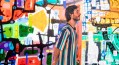 Sam Kissajukian in front of his art during a performance of 300 Paintings. Photo: Sarah Findlay.