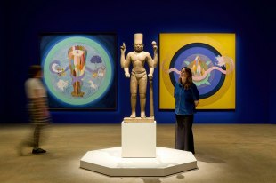 Installation view of the Avatar: Forms of Vishnu exhibition at the Art Gallery of New South Wales, featuring works by Desmond Lazaro and Cambodian Vishnu statue from the early 800s, photo © Art Gallery of New South Wales, Jenni Carter.