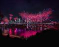 Riverfire by Australian Retirement Trust returns for Brisbane Festival 2026. Fireworks light up Brisbane's skyline and bridges at night, and are reflected in the Brisbane River.