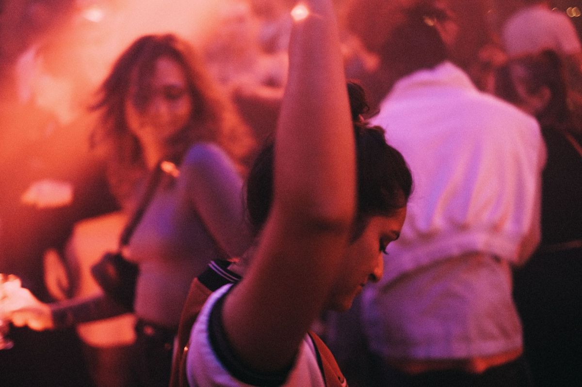 People dance in a club, lost in the music. arts sector appointments