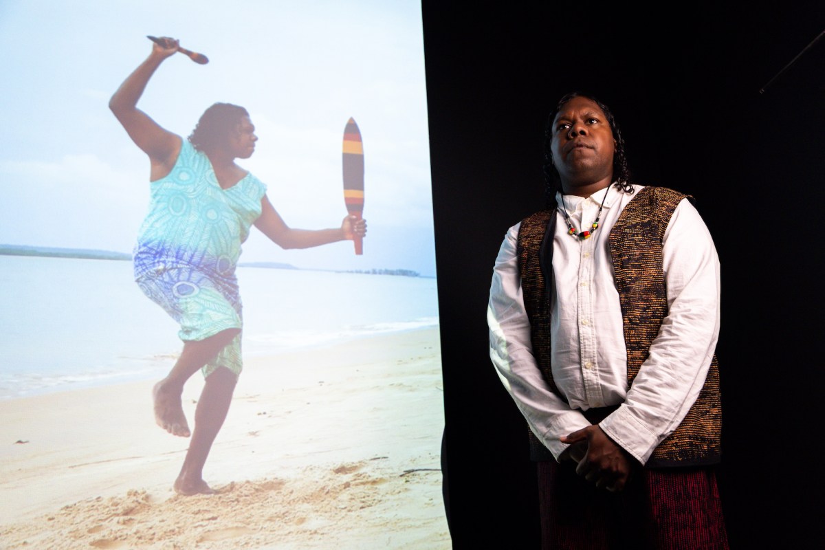 Colin Heenan-Puruntatameri with ‘Ngirramini Ngini Amparruwu (The story of the widow)’ 2026. Courtesy of the artist and Jilamara Arts and Crafts Association. Photo: (l-r) Katherine Travis and Charlie Bliss.