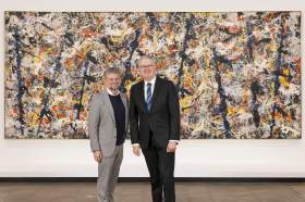 Federal Arts Minister Tony Burke with NGA Director Nick Mitzevich in front of Blue poles (1952) by Jackson Pollock. Photo courtesy NGA.