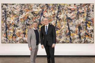Federal Arts Minister Tony Burke with NGA Director Nick Mitzevich in front of Blue poles (1952) by Jackson Pollock. Photo courtesy NGA.
