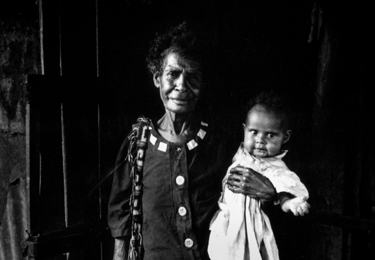 Grandmother with baby, Six Mile settlement, Port Moresby, Papua New Guinea, 2003. Photo: Lorrie Graham.