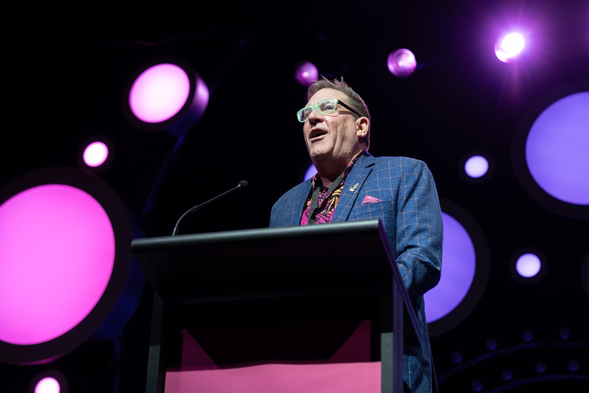 Harley Stumm accepts an IMPACT Award. Photo: Alex Sibbison.